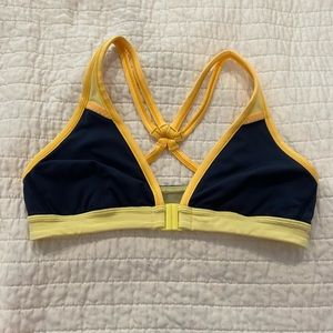 Lululemon bathing suit top. Front clasp. Size 6. Navy/yellow. No damages.